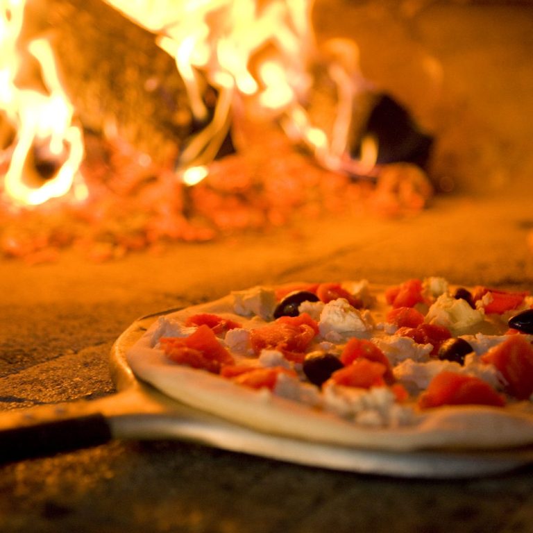 Pizza oven burning logs, Poole Dorset